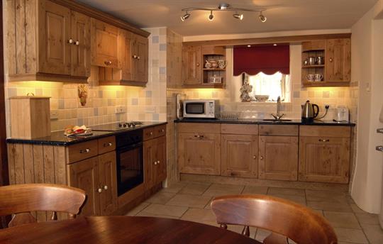 Oak kitchen with granite worktops