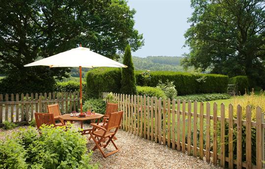 Sunny enclosed patio area off sitting room