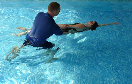 Ian giving a one-to-one swimming lesson