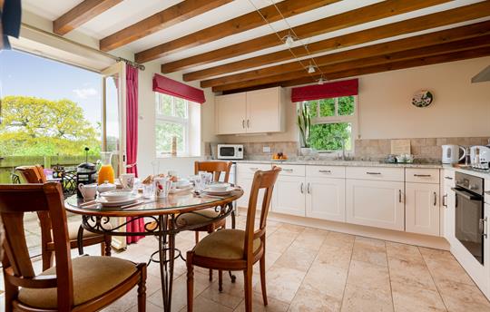 Forge dining kitchen with french doors 