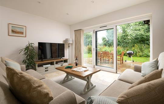 Living room with bifold doors onto the patio