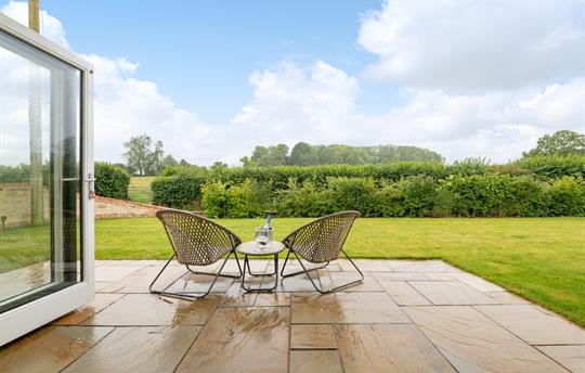 Private patio opening onto the garden