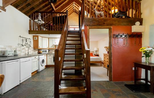 Stairs to a mezzanine lounge area 