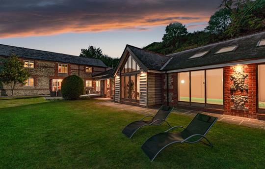 Dove House and pool at dusk