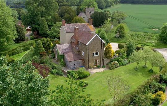 Stunning, mature gardens surround the house