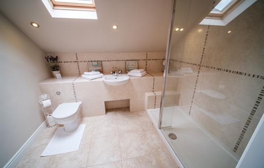 En suite bathroom to king-size bedroom