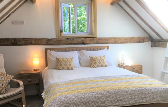 King-size bedroom has views over the fields