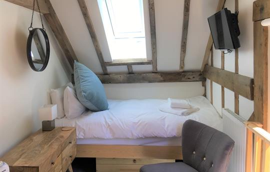 Twin bedroom with views over the fields