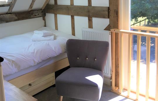 Bright and airy twin bedroom with great views