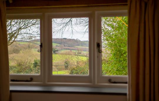 View through the window over open rolling farmland