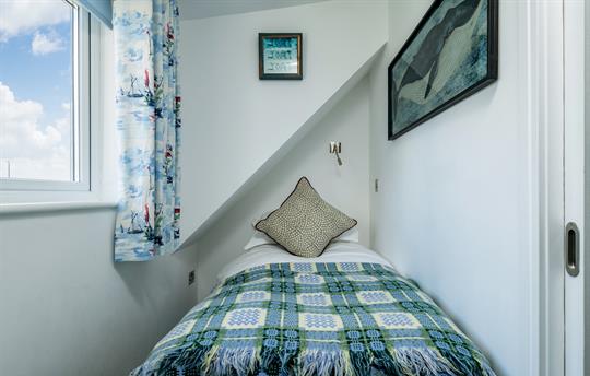 Upstairs bunk bedroom with third bed