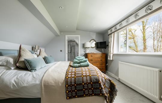 Upstairs master bedroom with en suite bathroom