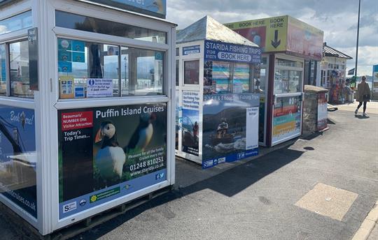 Boat trips kiosks on the Beaumaris pier