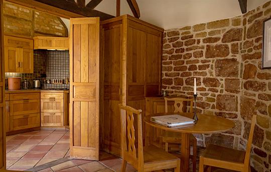 Dining area and kitchen in Hazelnut cottage