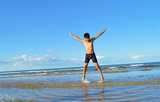 Boy enjoying north Norfolk beaches