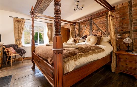Stunning master bedroom with four-poster bed
