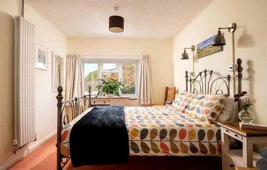 Spacious double bedroom with king size bed