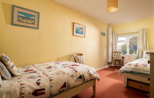 Twin bedroom towards window