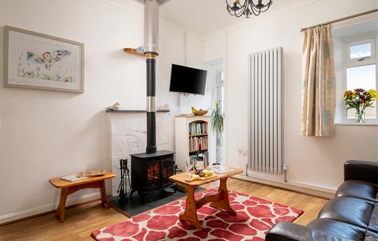 Seating area with Stressless sofas and log burner