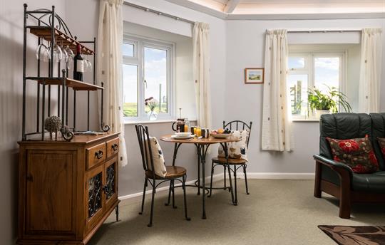 Spacious living area with feature lighting