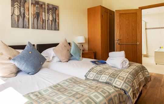 En-suite accessible bedroom in Teal Cottage