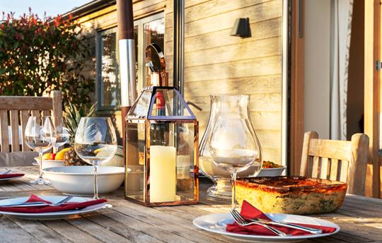 Teal patio table laid for al fresco dining