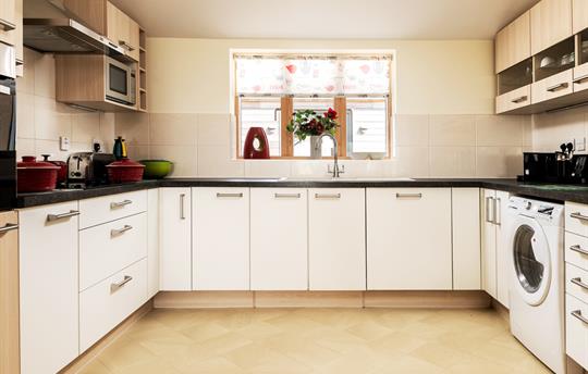 Teal kitchen is very spacious