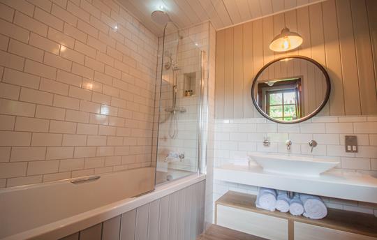 Bathroom with shower over bath