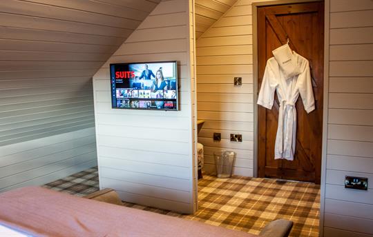 Main bedroom with Smart TV and dressing area