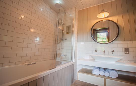 Bathroom with shower over bath