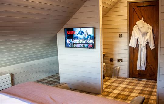 Main bedroom with Smart TV and dressing area