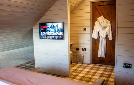 Main bedroom with Smart TV and dressing area