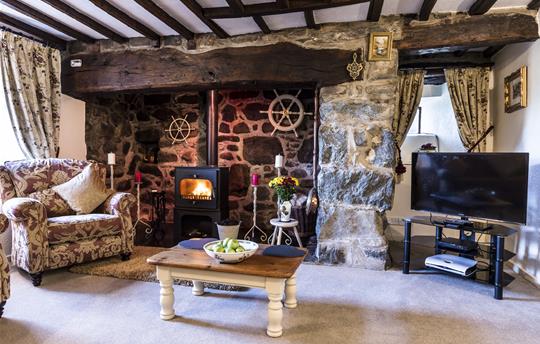 Lounge with original beams and fireplace C1675