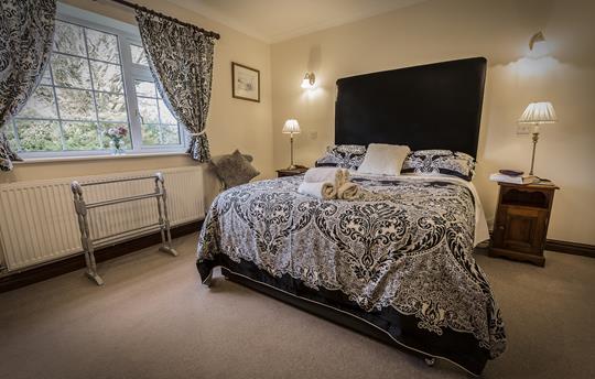 Spacious king-size bedroom with en suite