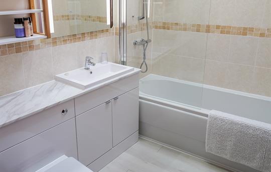 Bramley bathroom with shower over bath