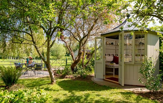 Summer house and patio setting