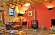 Lounge with cosy woodburner