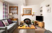 A cosy living room with log burner