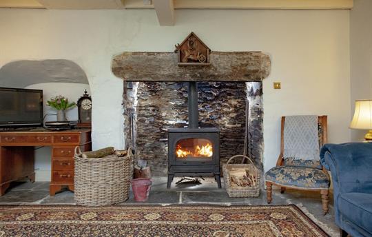 Farmhouse living room w/ large woodburner
