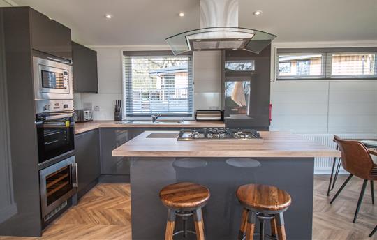 Kitchen with island and breakfast bar