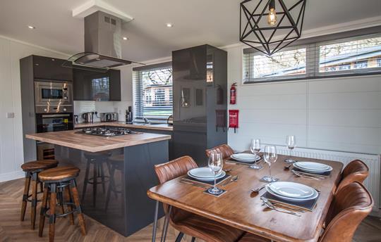 Dining table and kitchen of Hawthorn Lodge