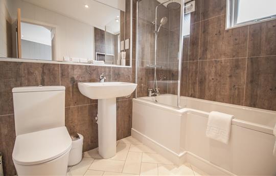 Ensuite bathroom with shower over bath