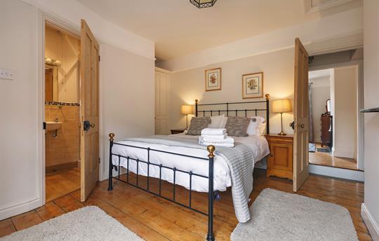 Master bedroom with door to ensuite shower room