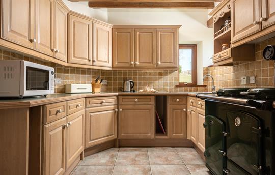 Well equipped kitchen with green Sandyford