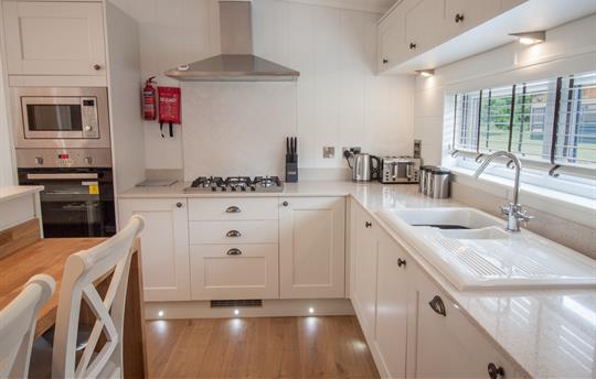 Stylish kitchen topped with cool quartz surfaces