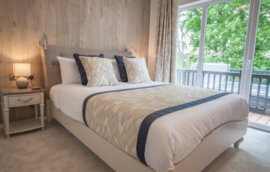 Master bedroom with kingsize bed and lovely views