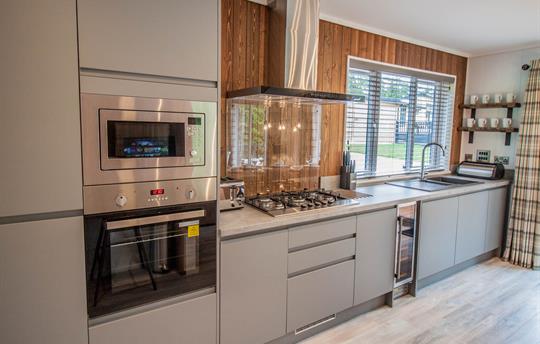 Kitchen with oven, hob, microwave, dishwasher etc