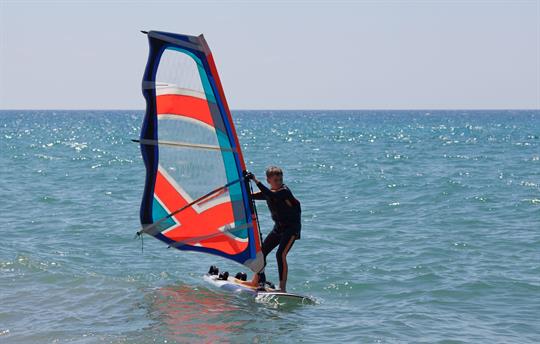 Surfboarding at Normans Bay