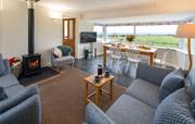 The open plan living room with log burner