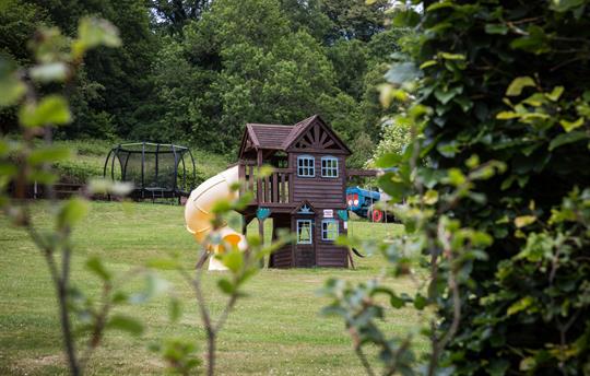 Children's play area - tractor, trampoline, swings